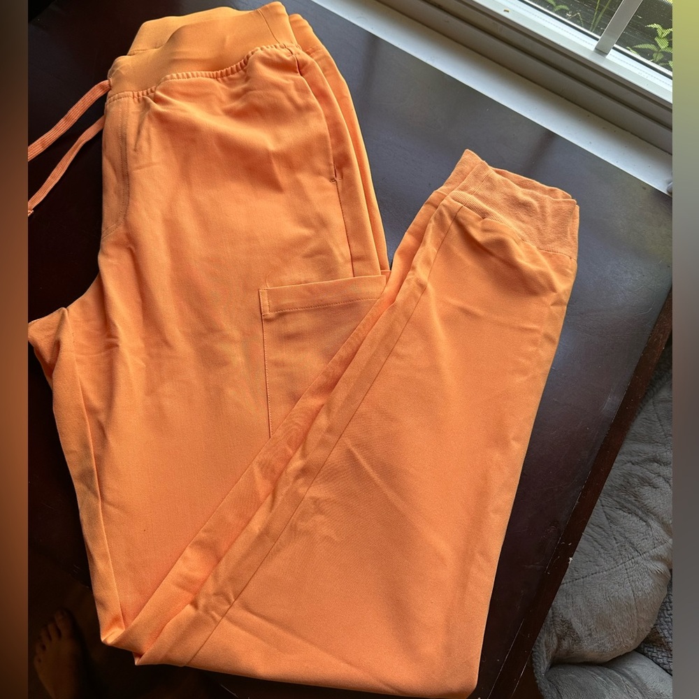 Size small- tall mandala joggers in cantaloupe